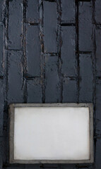 Mock up blank poster picture frame on blue brick wall.