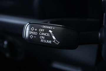Closeup of adaptive cruise control leaver. Adaptive cruise control switch. 