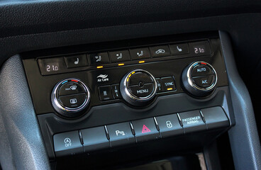 Air conditioner switch, temperature switch.  Luxury car interior.