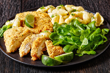 breaded chicken fillet with alfredo pasta shells