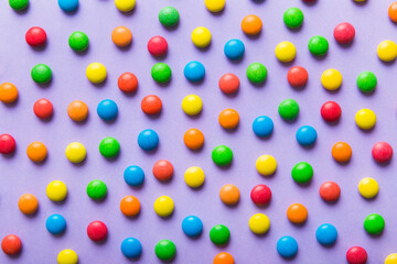 colorful candies as background top view. Seamless pattern with candy. Many sweet candies close-up