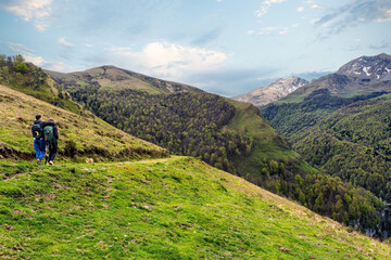 Young couple hiking in the mountains of the French Basque Country