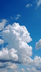 Naklejka na ściany i meble Vertical background with serene blue sky and white clouds
