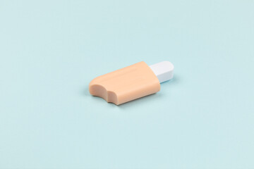 closeup of a popsicle on cyan surface icecream
