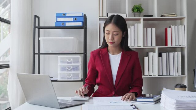 Portrait of a woman working on a tablet computer in a modern office. Make an account analysis report. real estate investment information financial and tax system concepts.