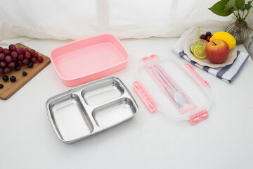 Colored plastic bento cutlery box placed on the table
