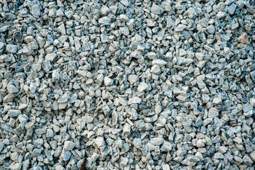 Black ground pile of stones for construction.