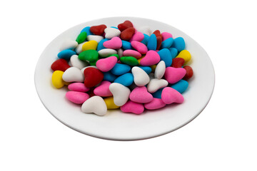 White plate with multi-colored heart-shaped sweets (close-up) on a transparent background