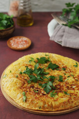 Frittata, traditional egg and potato omelette, Italian dish