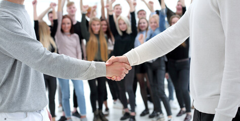 young business people shaking hands with each other