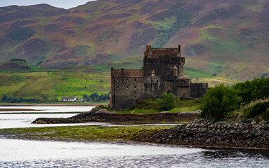 Eilean Donan Castle in Scotland in the evening. Tidal island between Loch Duich, Loch Long and Loch Alsh. Western Highlands, Scotland, Great Britain, United Kingdom.