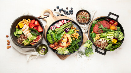 Healthy vegetarian and vegan  salads and Buddha Bowls with vitamins, antioxidants, protein on light  background.