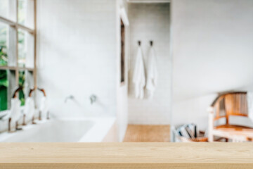 Empty wooden shelf against blurred bathroom interior