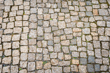 The road is paved with decorative stone