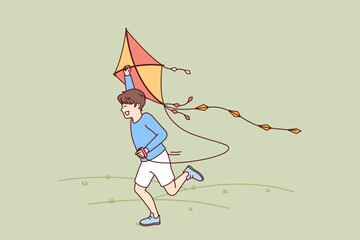 Little boy with kite runs through meadow enjoying summer walk with favorite toy. Happy kid laughing while flying kite for concept of carefree childhood and teen outdoor activity Generative AI