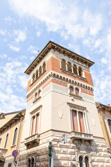 Fototapeta premium detail of a tower at the San Cassiano square in Mortara, Province of Pavia, region of Lombardy, Italy