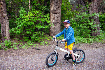 Fototapeta premium a boy on a bicycle in the park
