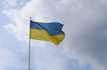Ukrainian flag on blue sky. Country flag against sky. Flags of the world. Peace in the world. Peaceful flag.