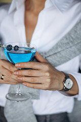 Woman drinking alcohol drink in a restaurant