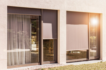 Roller Blinds on Panoramic Window Outside of Modern House. External Shutters. Sun Protection...