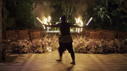 man dancing national Balinese dance with fire