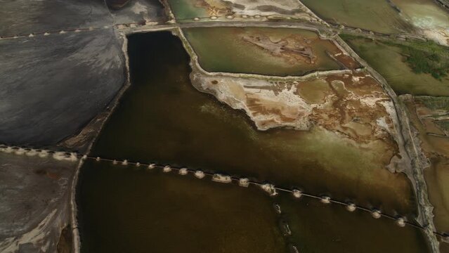 aerial shot of limestone quarry green lake with clean dark blue water