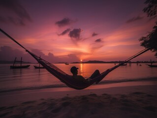 A Traveler Relaxing on a Hammock on a Tropical Beach During Sunset