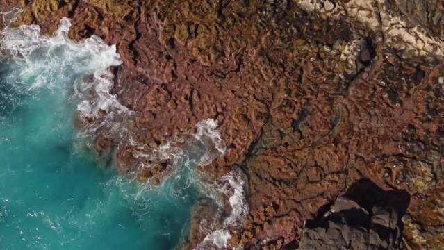 Amazing top down aerial view of rocky volcanic coast in Tenerife island