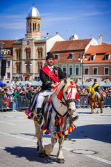 Brasov, Romania. Junii Brasovului or Parada Junilor, the most popular event in the city. - obrazy, fototapety, plakaty