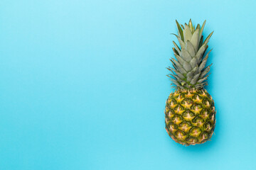 Fresh pineapple on color background, top view