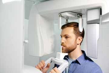 Panoramic image of teeth. A patient in a modern dental clinic takes a panoramic picture of the teeth. Prevention of dental diseases. Accurate diagnosis.