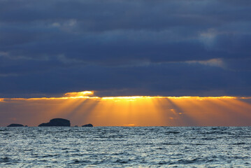 Crepuscular Rays on the Horizon at Duntulm, Isle of Skye, Scotland, UK.