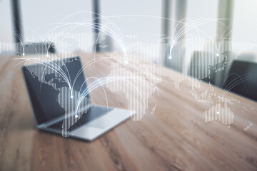 Double exposure of abstract digital world map with connections on laptop background, research and strategy concept