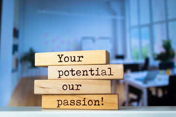 Wooden blocks with words 'Your potential our passion'.