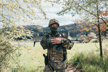 Soldier in a trench. Member of the International Legion patrols. The war in Ukraine.Army soldier...