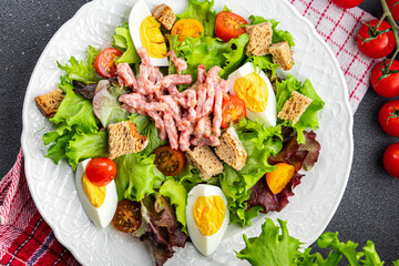 bacon salad, egg, crouton, lettuce, salad dressing vinaigrette  cuisine  meal food snack on the table copy space food background rustic top view