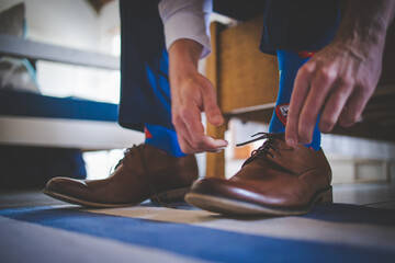 Close up creative image of a Groom's Wedding Attire at a real wedding