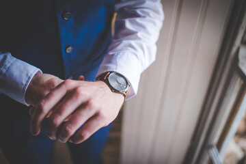 Close up creative image of a Groom's Wedding Attire at a real wedding