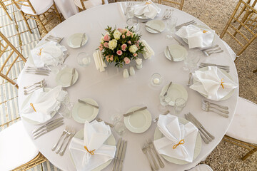 Wedding table setting for dining outdoors. Wedding, decoration, celebration, floral design, holidays concept