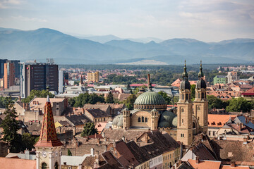 Fototapeta na wymiar High angle elevated perspective from the tower over the city of Sibiu in Romania. European travel and architectural destination in Eastern Europe 