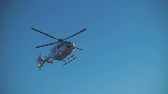 Film crew's helicopter flies over the desert during filming. Movie production