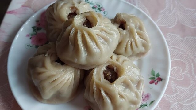 Traditional Buryad Cuisine Food with Chopped Meat and Dough. Preparing Making Dumplings Close-up	
