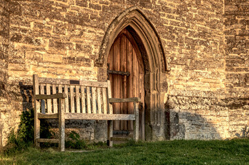 Fototapeta na wymiar old wooden bench in the old castle
