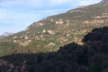 Fototapeta na wymiar Mountains of Mallorca island . Shadow on the green mountain 