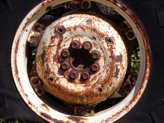 old rusty and white wheel with tire