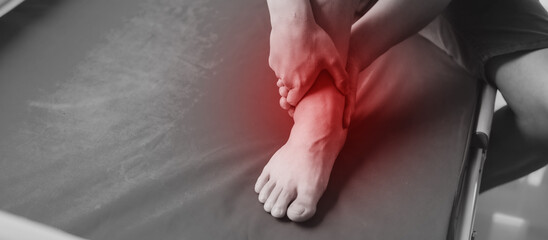 Obraz premium Close up man suffering from ankle pain.