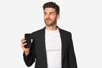 Young business caucasian man dreaming of achieving goals and purposes