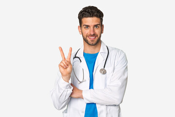 Fototapeta premium Young doctor man showing number two with fingers.