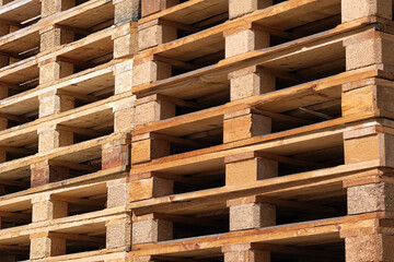 Close-up of a lot of wooden pallets for transporting various goods.