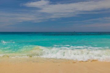 Fototapeta na wymiar Beautiful view of sandy beach of Eagle Beach with turquoise water of Atlantic Ocean on island of Aruba.